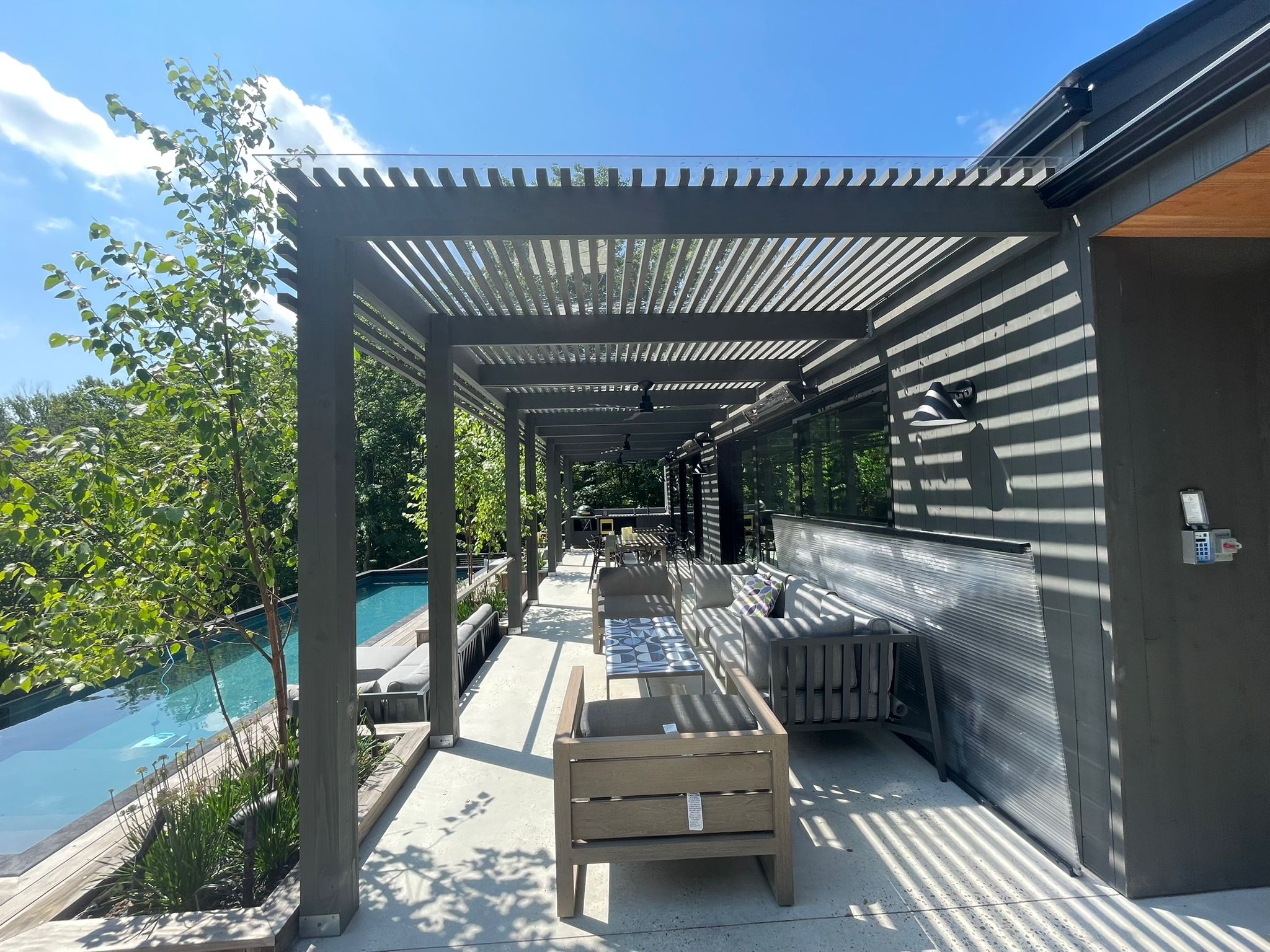 Modern Outdoor Pergola Lounge by the Pool