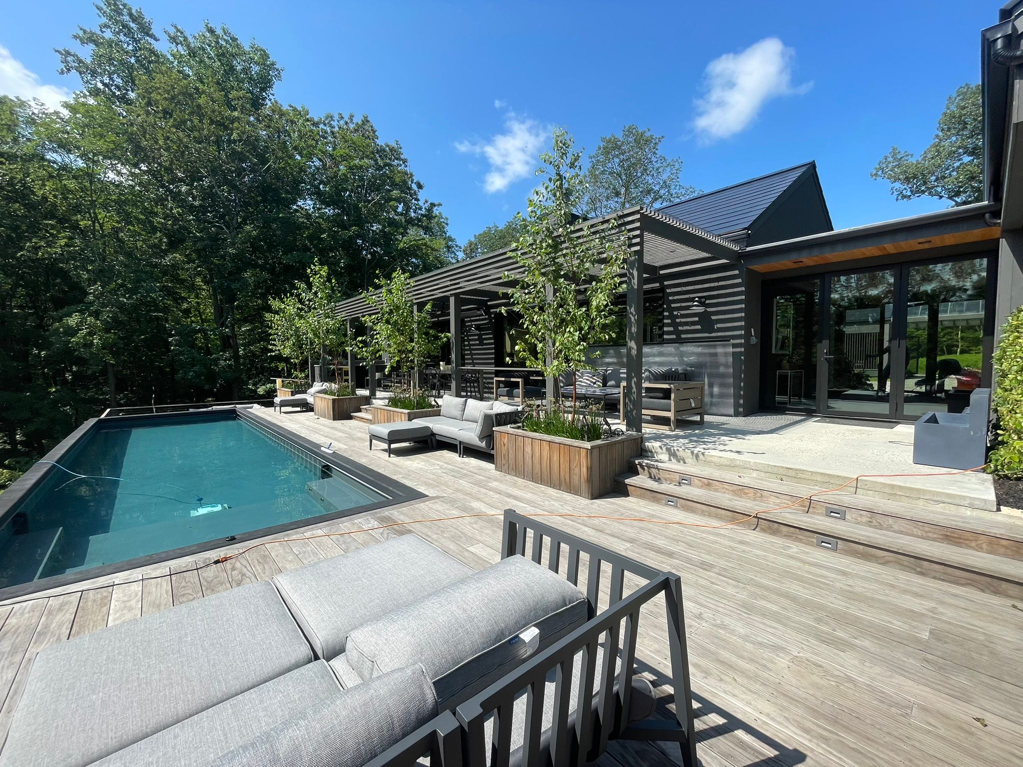 Beautiful modern kitchen renovation with white cabinets and hardwood floors by MEG CARPENTRY LLC